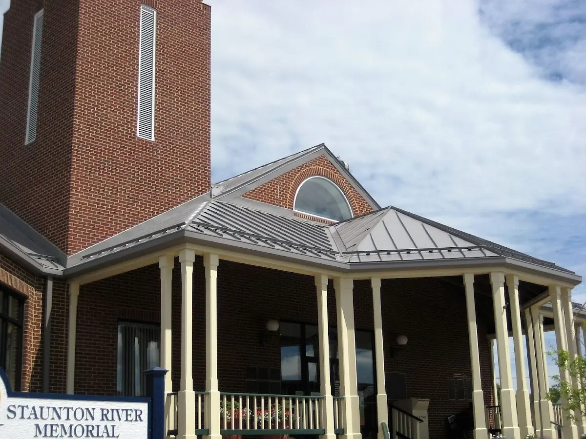 Skilled roofing craftsmen working on a residential roof in Delaware